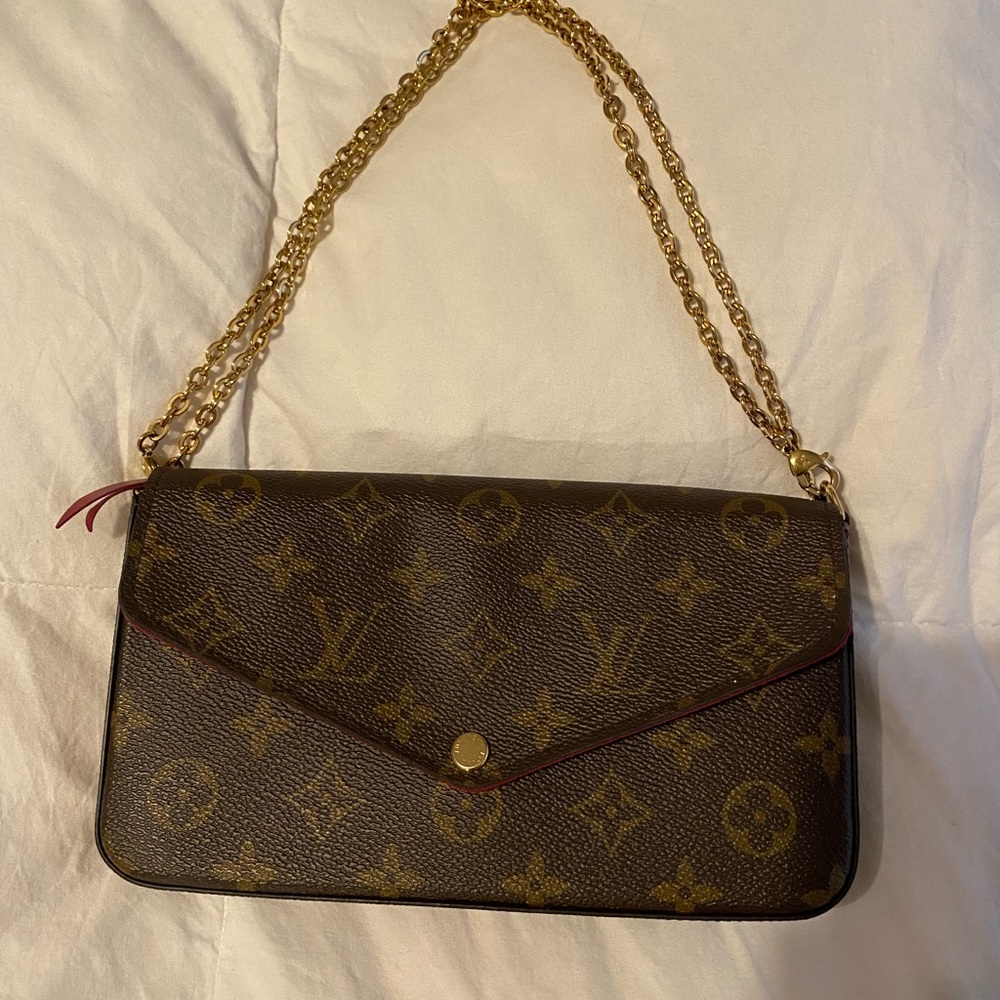 Brand new authentic Louis Vuitton cross body/ clutch for sale